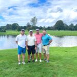 Four men at golf