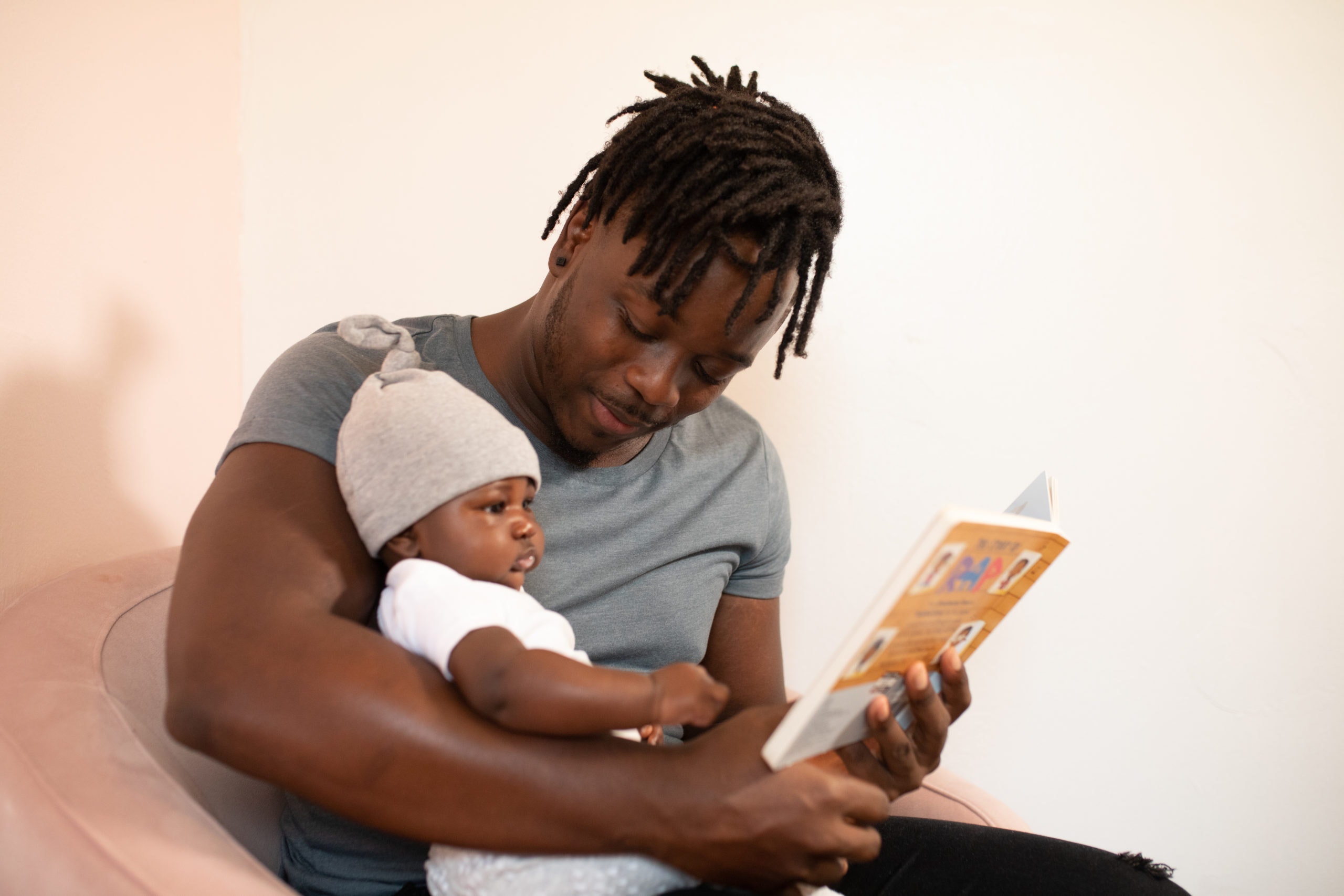Father reading to his baby.