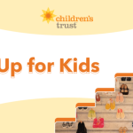 Graphic with “Step Up for Kids” in bold orange letters, the Childrens Trust logo at the top, and stairs lined with pairs of childrens shoes on the right.