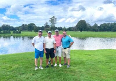 Four men at golf